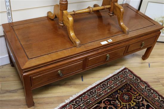 A low Chinese hardwood three drawer table, W.127cm